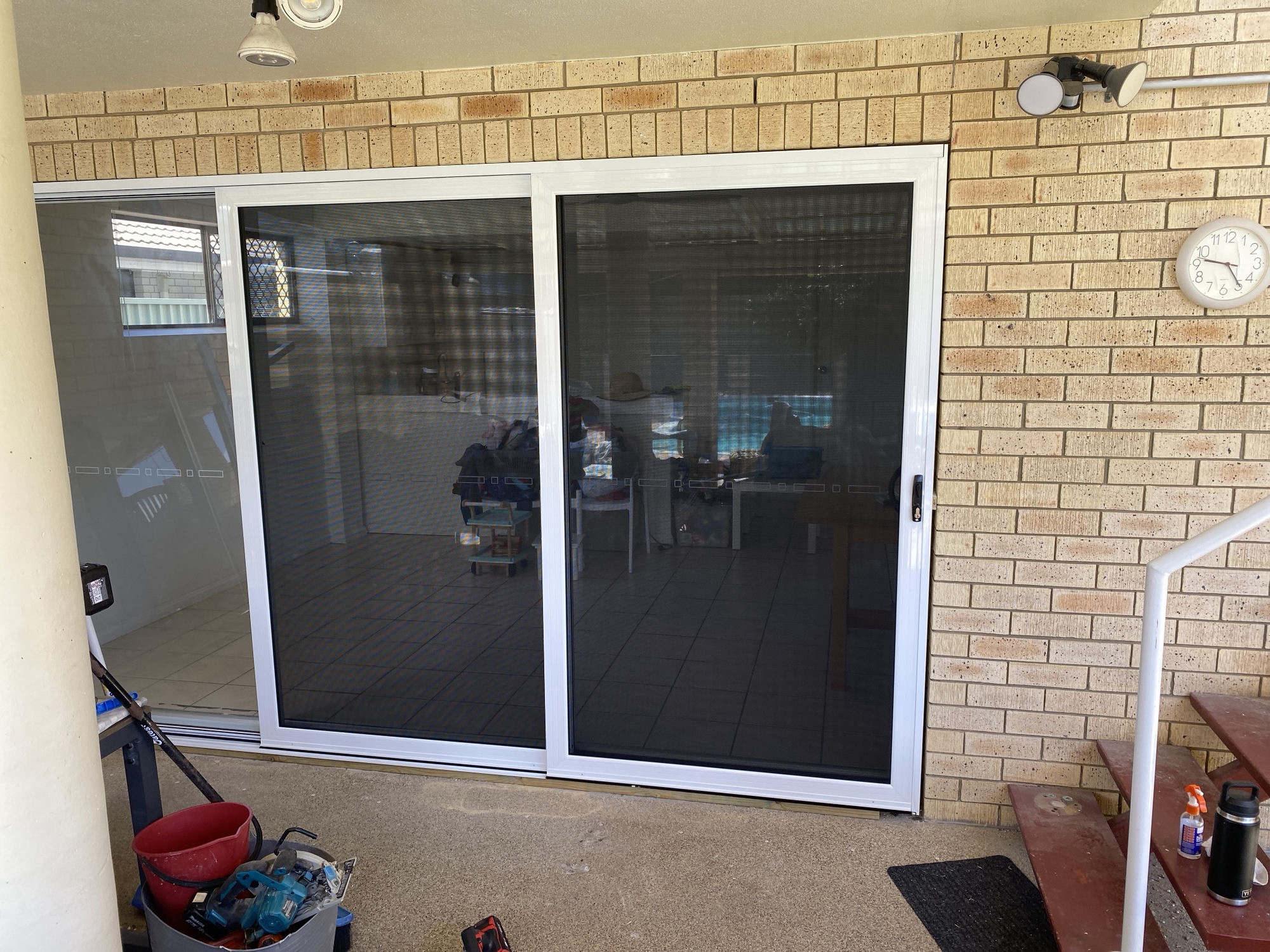 Security screens installed on brick home