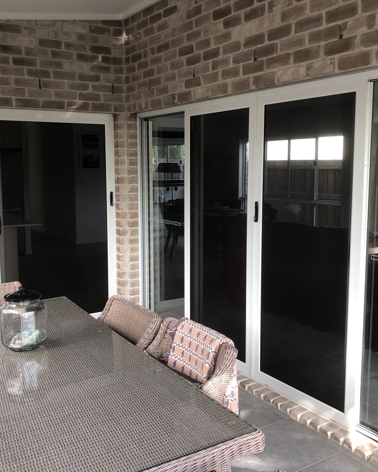 Security screens and doors on brick home