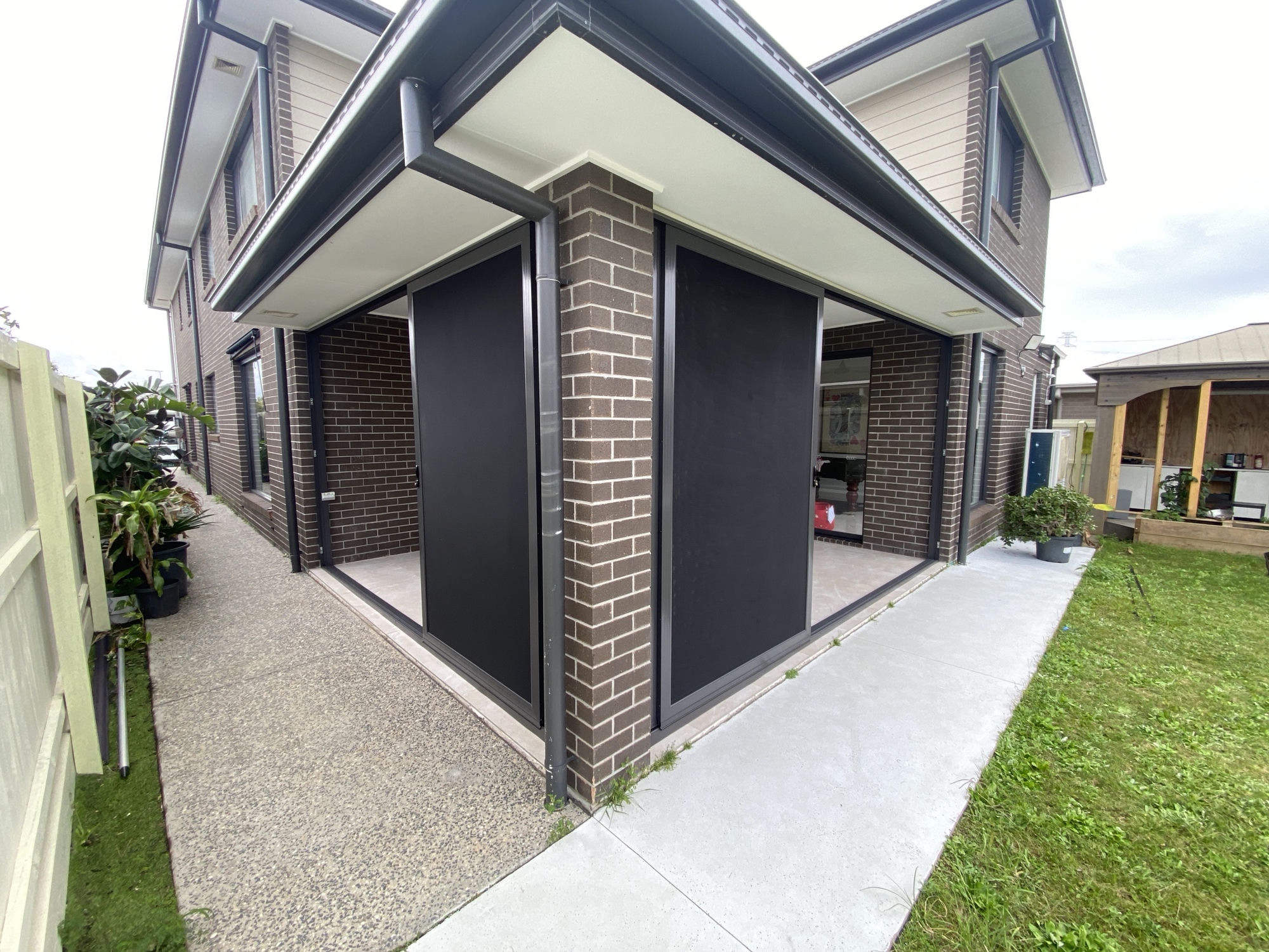 Corner security screens on modern home