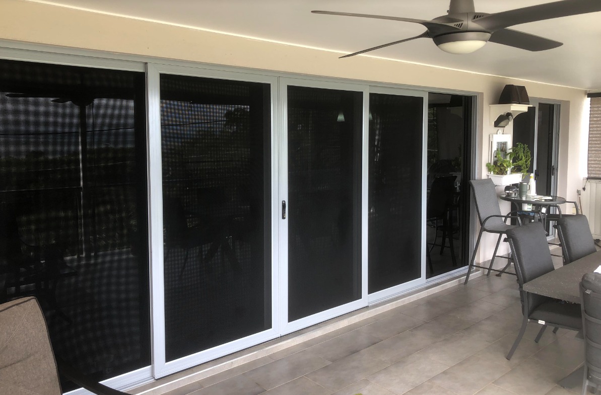Large sliding security screens on covered alfresco