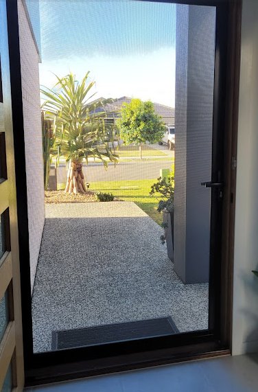 Timber-frame security door looking out to garden